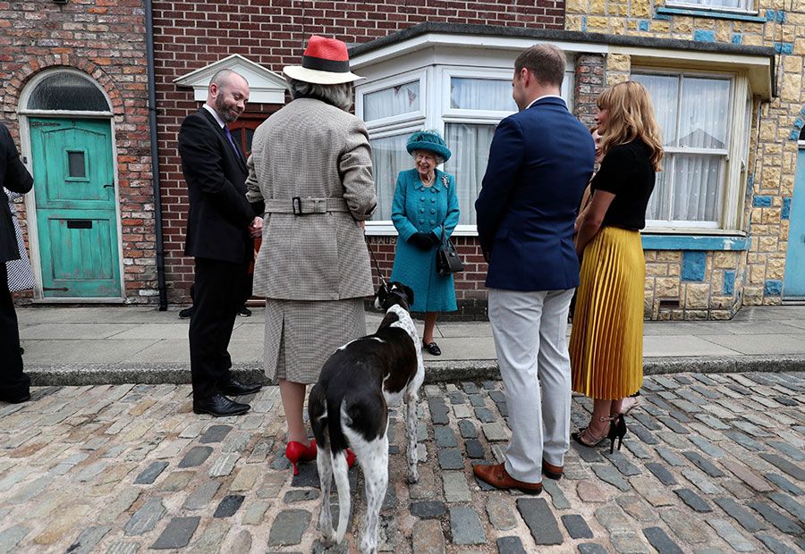 The Queen visits Coronation Street set as she enjoys a day out in Manchester - best photos