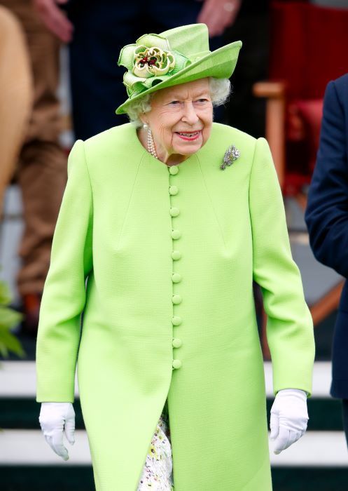 the queen green suit walking