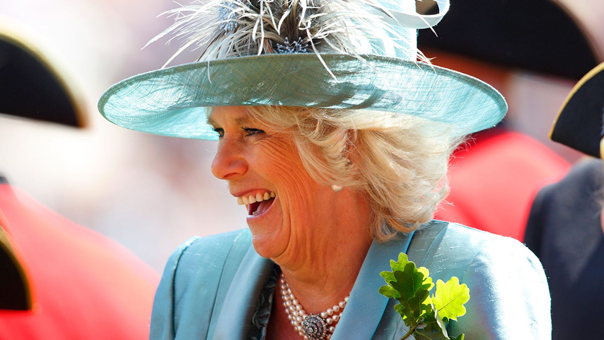 The-Duchess-of-Cornwall-laughs-in-light-blue